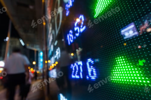 Preview: Stock market quotes with city scene reflect on glass