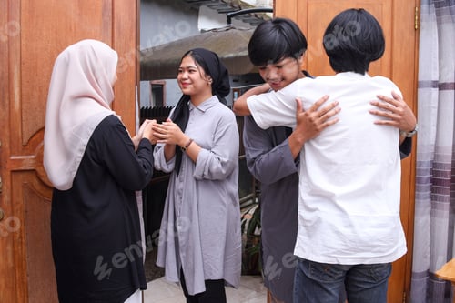 Preview: Muslim people hand shaking, hugging, asking for apologize during eid mubarak moment.