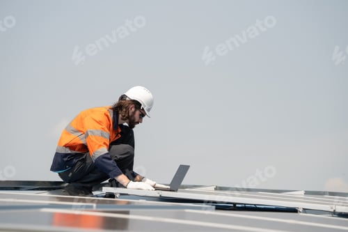 Preview: Engineer checking solar cell panel by computer laptop