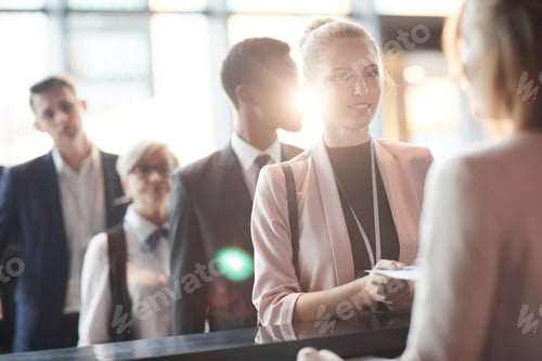 Preview: Businesswoman registering at office