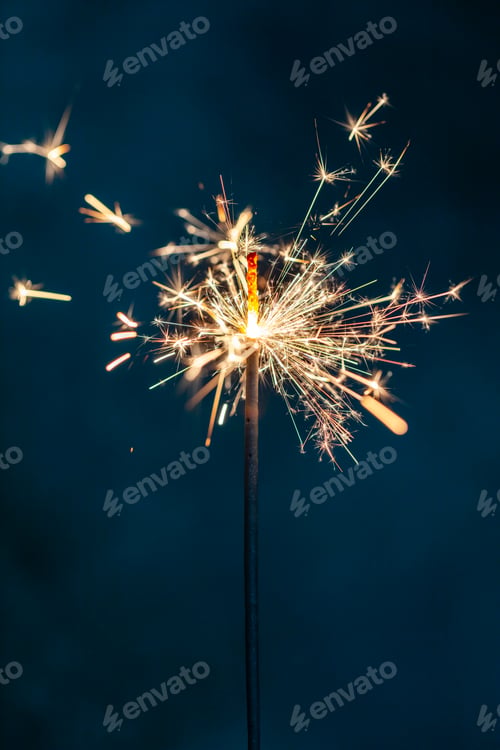 Preview: Christmas bengal fire sparkles against the black background.