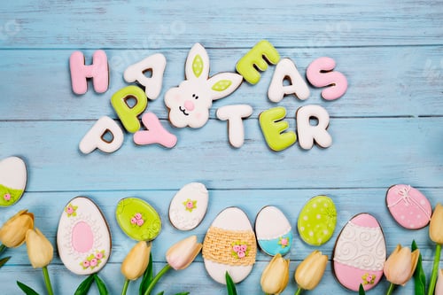 Preview: Easter cookies letter Happy Easter and colorful eggs with tulips on wood background