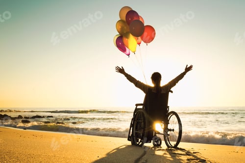 Preview: Woman in Wheelchair with Balloons on Sandy Beach