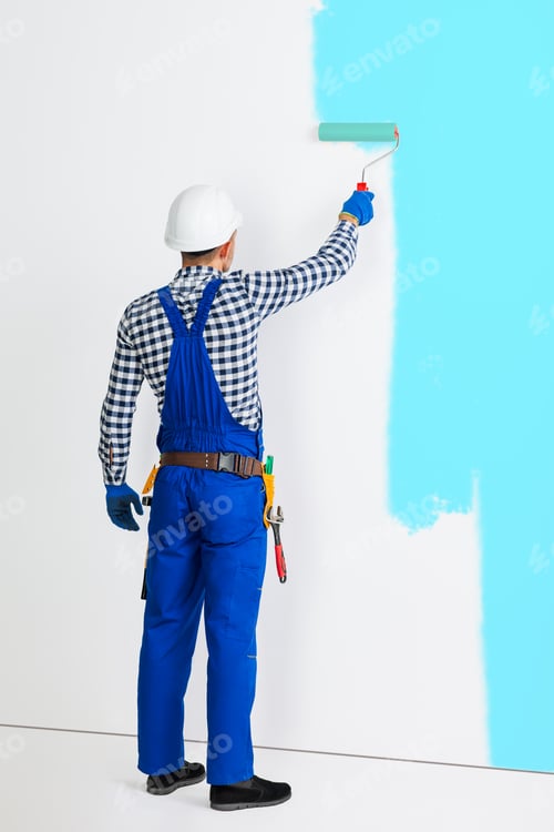Preview: Full length portrait of rear view of painter man painting the wall in blue