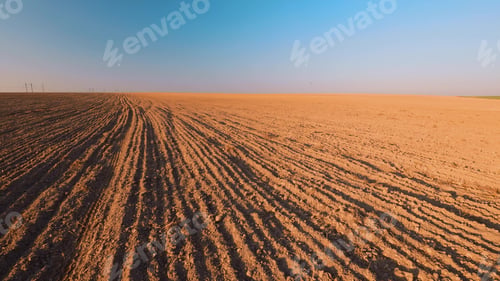 Preview: Spring Plowed Field In Sunset Light. Ploughed Field In Early Spring. Farm, Agricultural Landscape