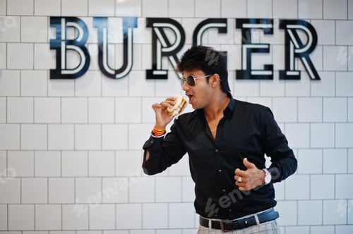 Preview: Indian man at fast food cafe
