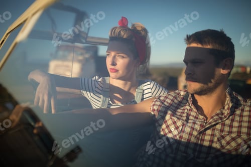 Preview: Couple sitting together in a car