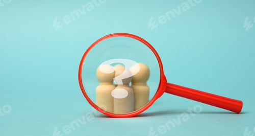 Preview: Wooden figurines of men and a red magnifying glass on a blue background. Recruitment for the company
