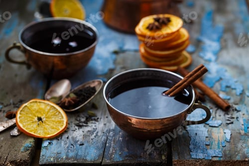 Preview: Grog in copper cups with spices and orange slices