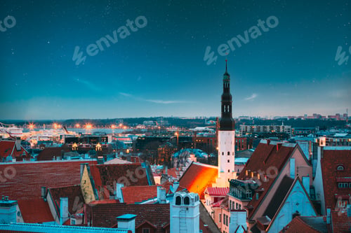 Preview: Tallinn, Estonia. Night Starry Sky Above Traditional Old Architecture Skyline In Old Town. Church Of