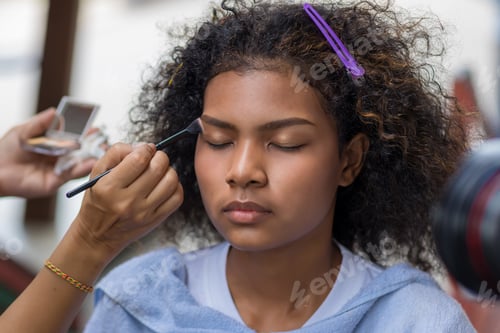 Preview: Woman Receiving Makeup Application for Beauty Editorial