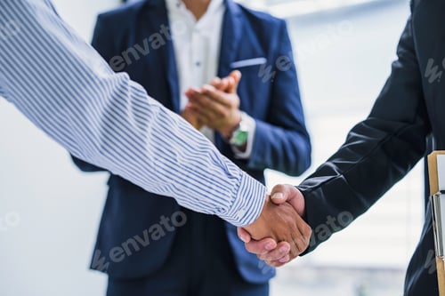 Preview: Business team people handshake discussing analyzing investment charts the charts and graphs showing