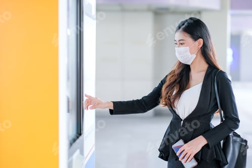 Preview: Beautiful business woman with hygiene mask point to sky train or transportation map