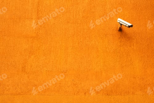 Preview: CCTV camera on orange building facade