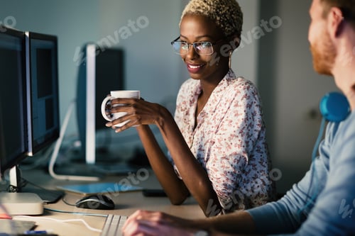 Preview: Colleagues working together in company office