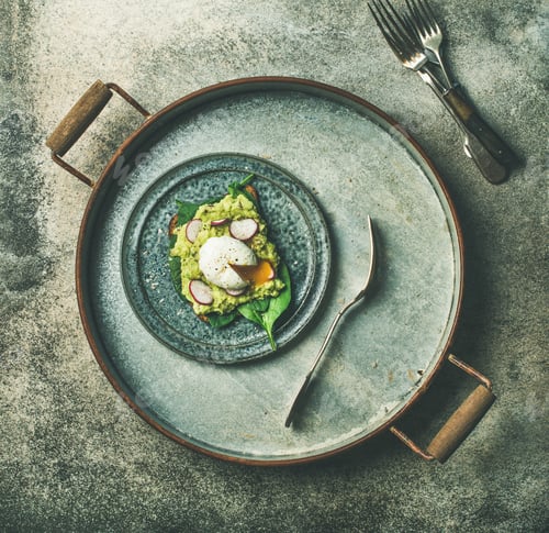 Preview: Healthy vegetarian wholegrain avocado toasts with poached egg on pan