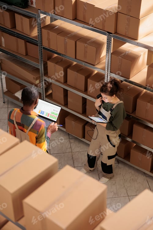 Preview: Storehouse worker doing products inventory on tablet