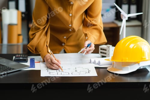 Preview: Architect designing with blueprints, compass, and safety helmet. Perfect for construction,