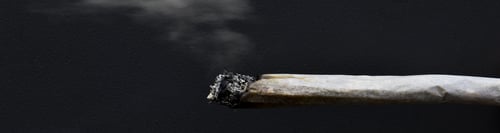 Preview: Burning joint isolated on a black background