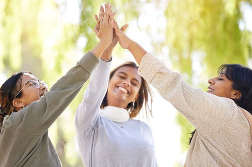 Preview: Friends, park and high five with joy in celebration for love, care and affection in nature. Female