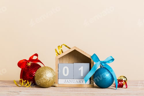 Preview: 1 january. Christmas composition on colored background with a wooden calendar