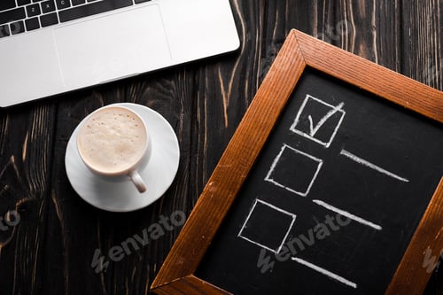 Preview: top view of chalk board with checklist near cup of coffee and laptop on table, e-commerce concept