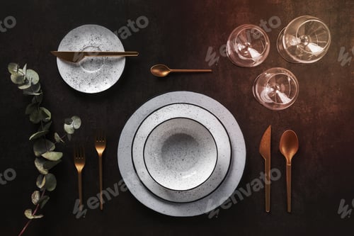 Preview: Overhead shot of a tea party table with glasses and utensils