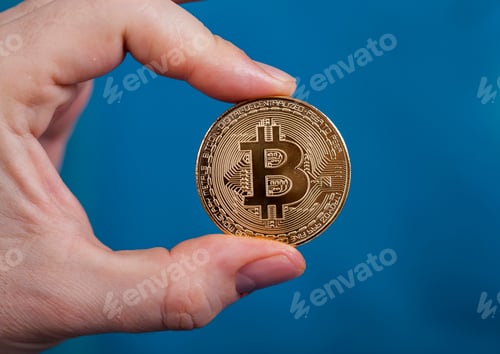 Preview: Man holding Bitcoin Cryptocurrency