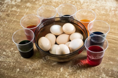 Preview: Easter eggs and colored liquid paints on the table
