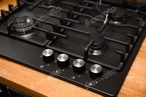 Preview: Minimalistic design of a modern gas stove, selective focus on burner control, appearance