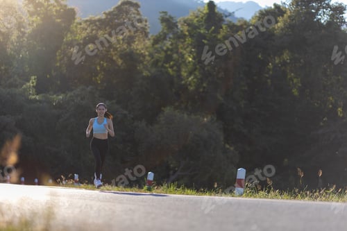 Preview: woman runner athlete on the road to healthy, Young people running exercise on street in the park.
