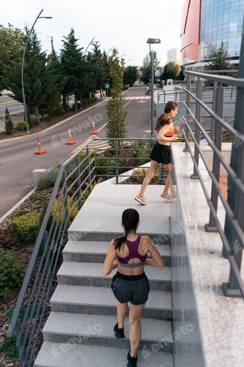 Preview: Women sprinting in the morning outdoors.