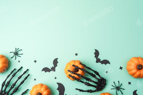 Preview: Halloween pumpkins, bats, spiders and skeleton hand decoration on a pale green background