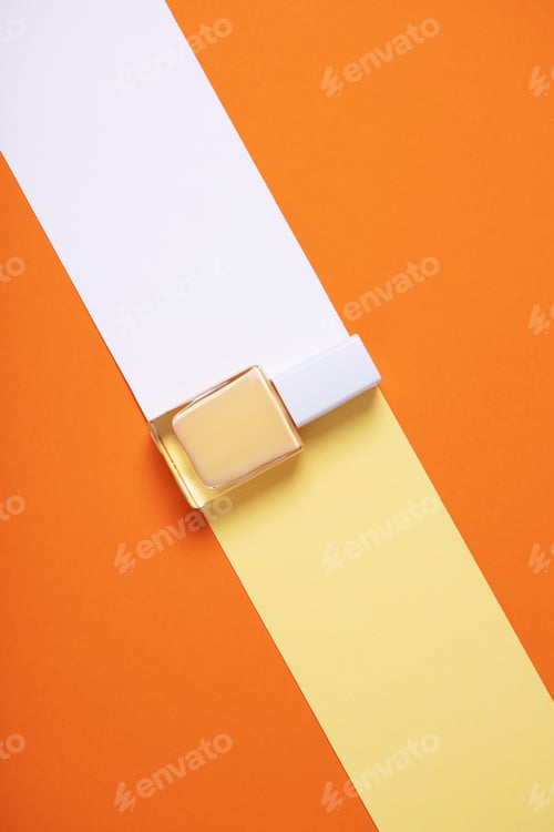 Preview: Vertical overhead shot of a yellow nail polish bottle on a geometric colorful background