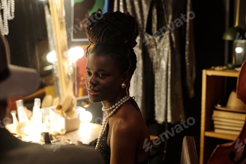 Preview: Young Black Woman Smiling Backstage Preparing for Jazz Music Performance