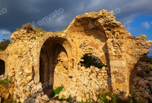 Preview: Ancient Stone Ruins with Arches Against Stormy Skies