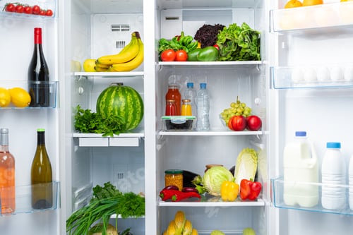 Preview: Open fridge full of fruits, vegetables and drinks