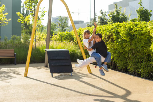 Preview: Girl playing on a swing in the park