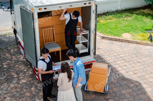Preview: Asian Couple check while unloading boxes and furniture from a pickup truck