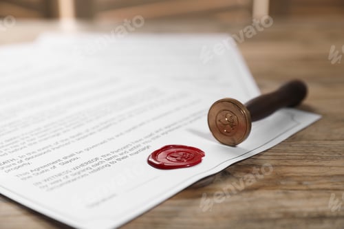 Preview: Documents with wax seal and stamp on wooden table, closeup