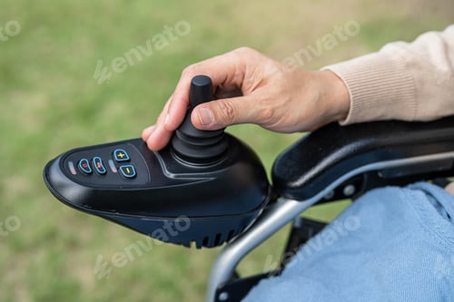Preview: Asian lady woman patient on electric wheelchair with joystick and remote control