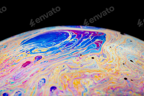 Preview: Multicolored abstract chaotic pattern inside of the soap bubble, closeup