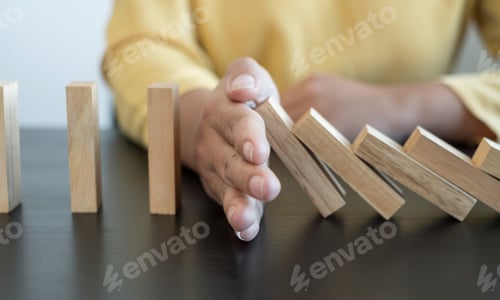 Preview: Hands of businesswomen playing wooden block game. Concept Risk of management and strategy plans for