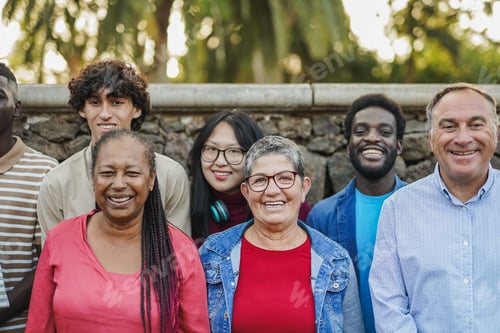 Preview: Multiracial people with different ages smiling on camera at city park