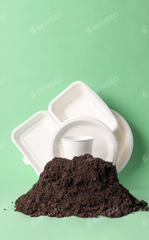 Preview: Set single-use tableware popular non-plastic alternatives in ground heap on green background