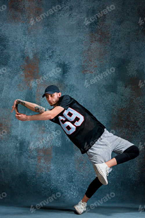 Preview: Young Man Break Dancing On Wall Background.