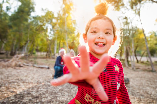 Preview: Excited Girl Reaching Outward in Forest Setting