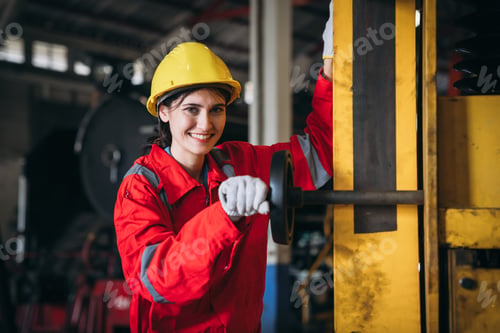 Preview: Industrial engineers inspect and perform maintenance on the machines at factory machines.