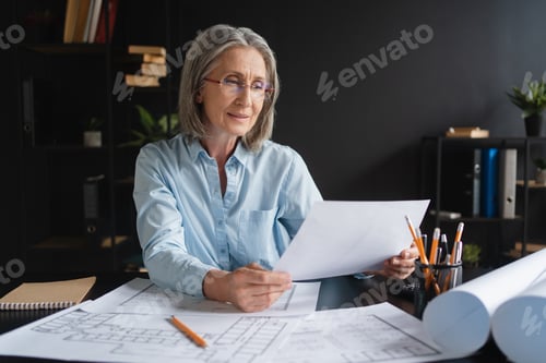 Preview: Architecture, drawing and blueprint with mature Caucasian woman architect, construction plan