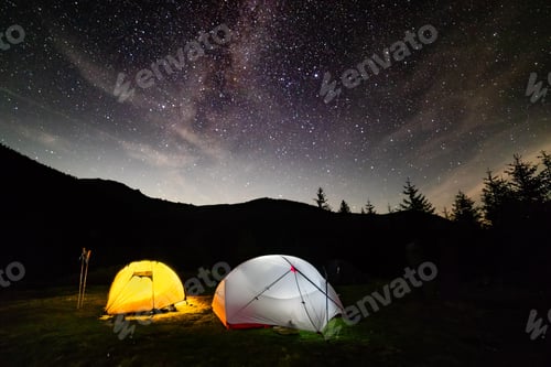 Preview: Milky way sky stars over mountain high tent camp